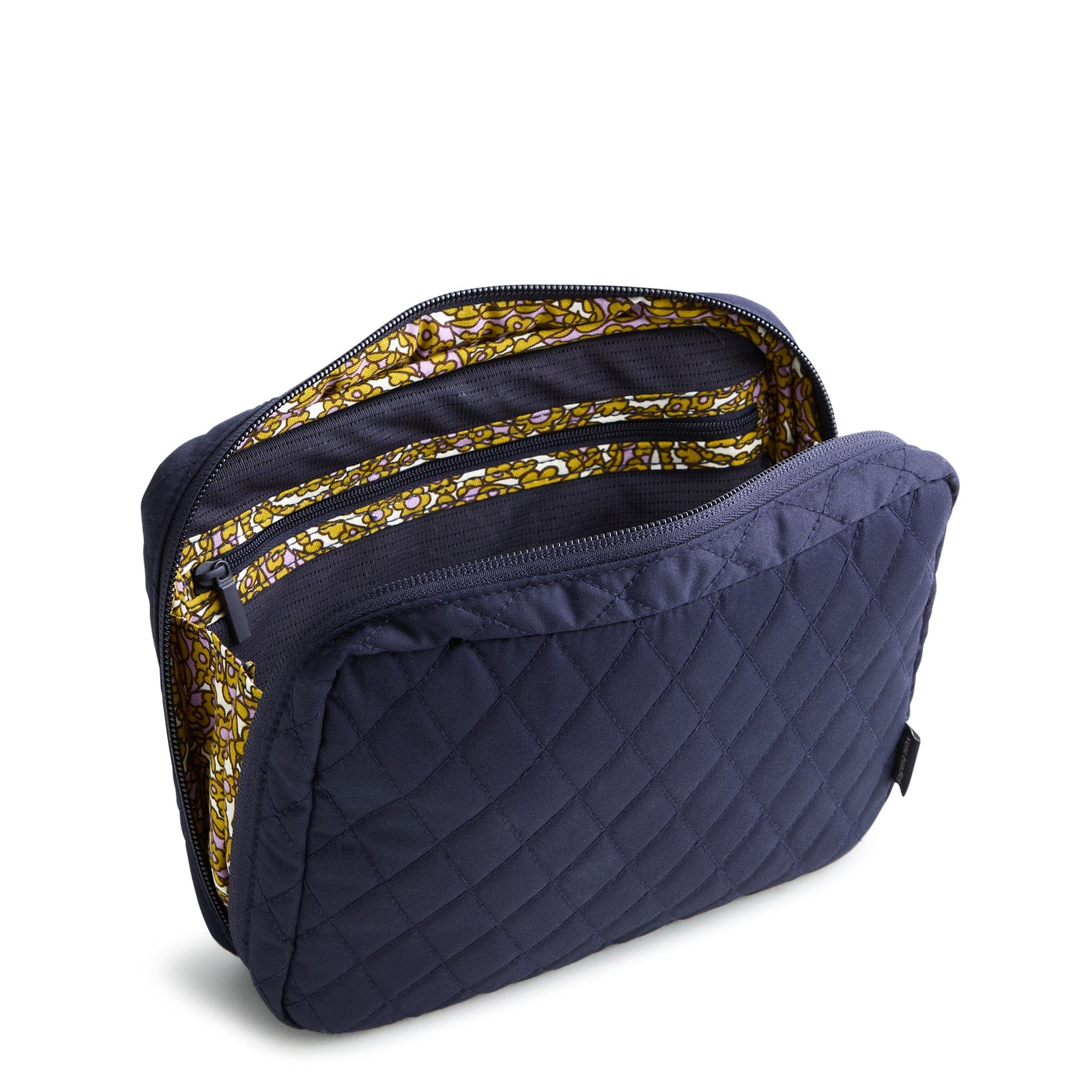 navy blue quilted cord organizer shown unzipped and open with interior zipped compartments and colorful pattern