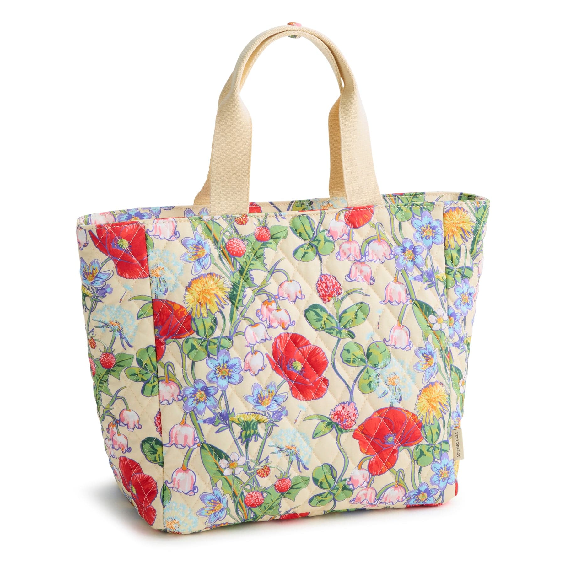 quilted cotton insulated lunch tote bag with cream handles and bright floral pattern