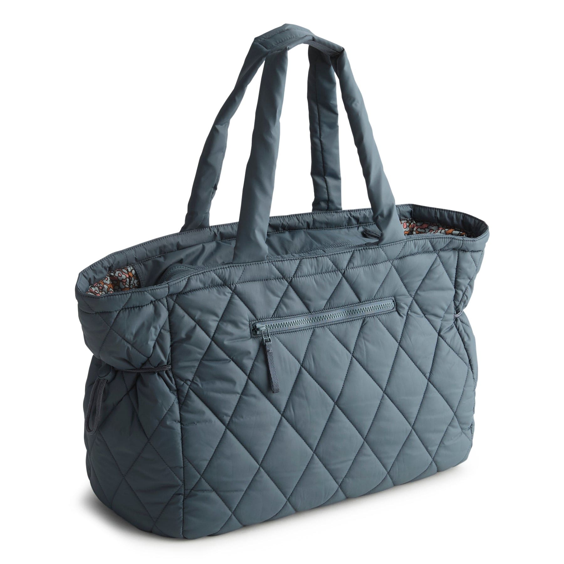 large quilted tote bag in dark slate blue color with two long handles and exterior zippered compartment