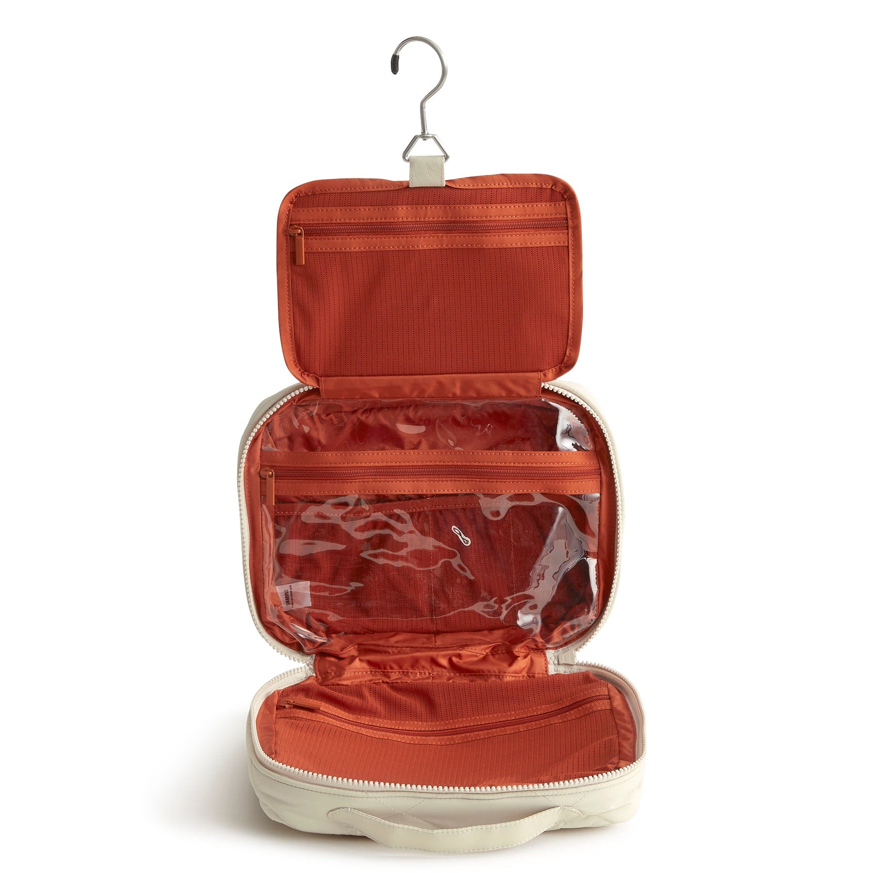 hanging travel organizer open to show three sections with storage pockets and hanger on top