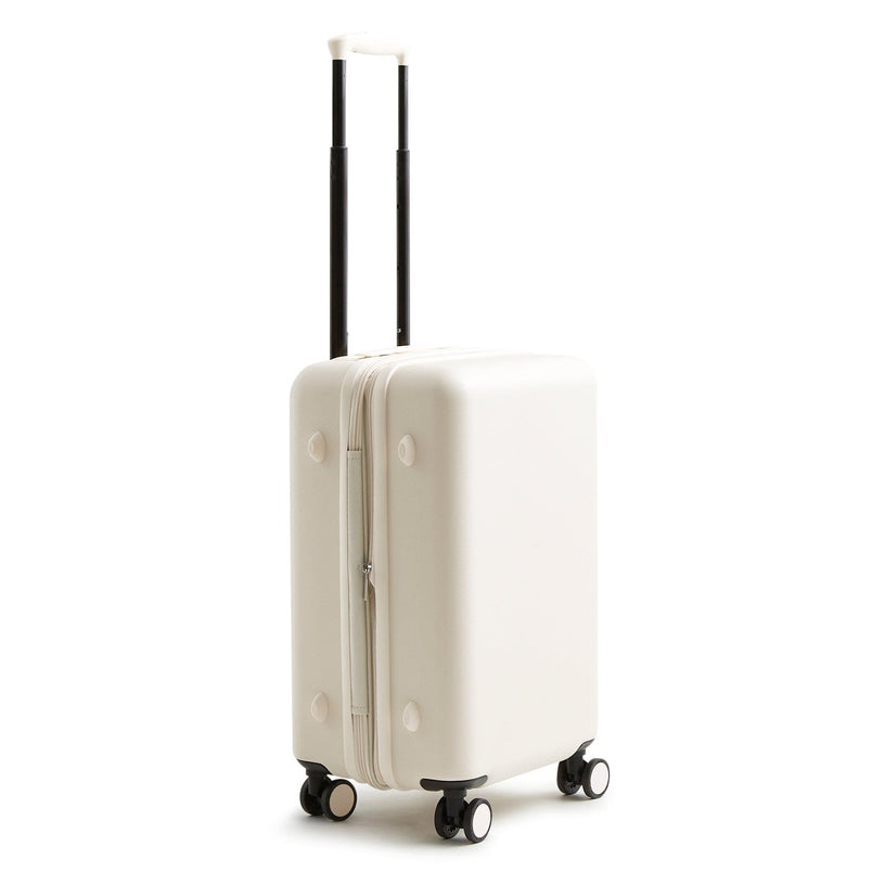 Adair cream colored hardside spinner carry-on bag