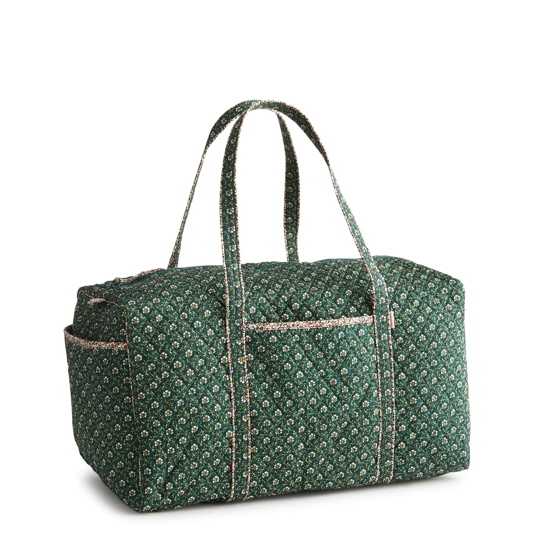 green quilted cotton duffel bag with long handles and small white flower pattern