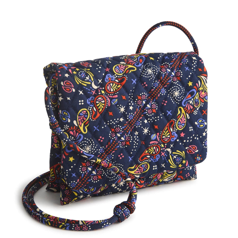 dark blue quilted cotton foldover crossbody bag with thin strap and multicolor paisley and stars pattern