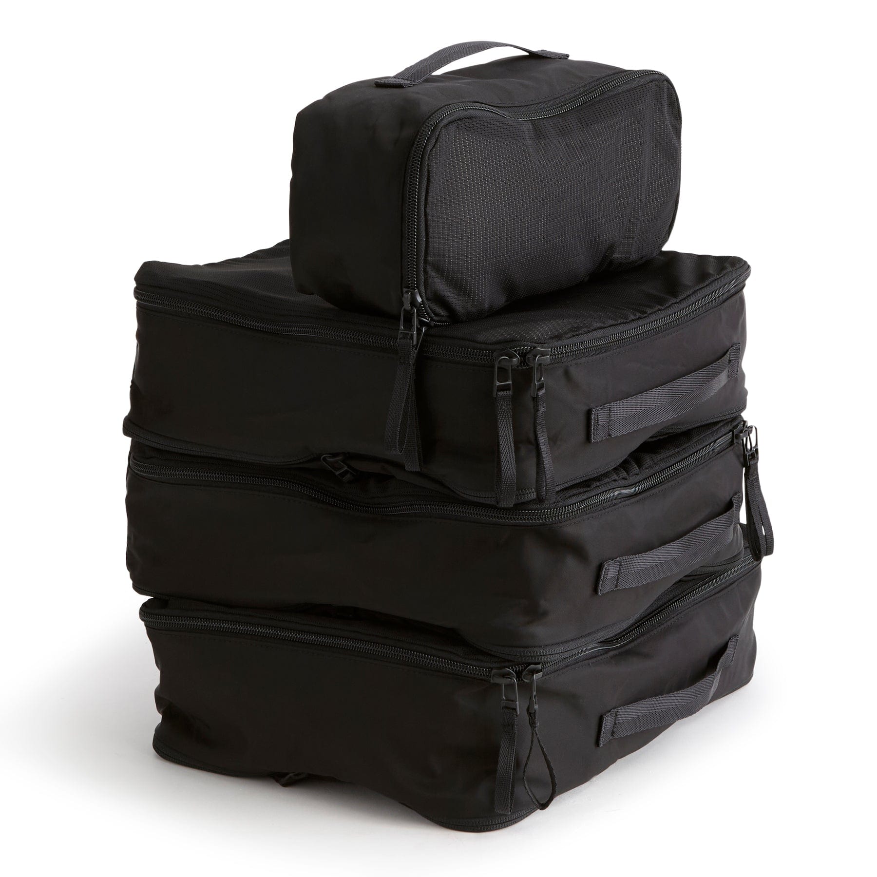 set of four green zippered packing cubes stacked on top of each other