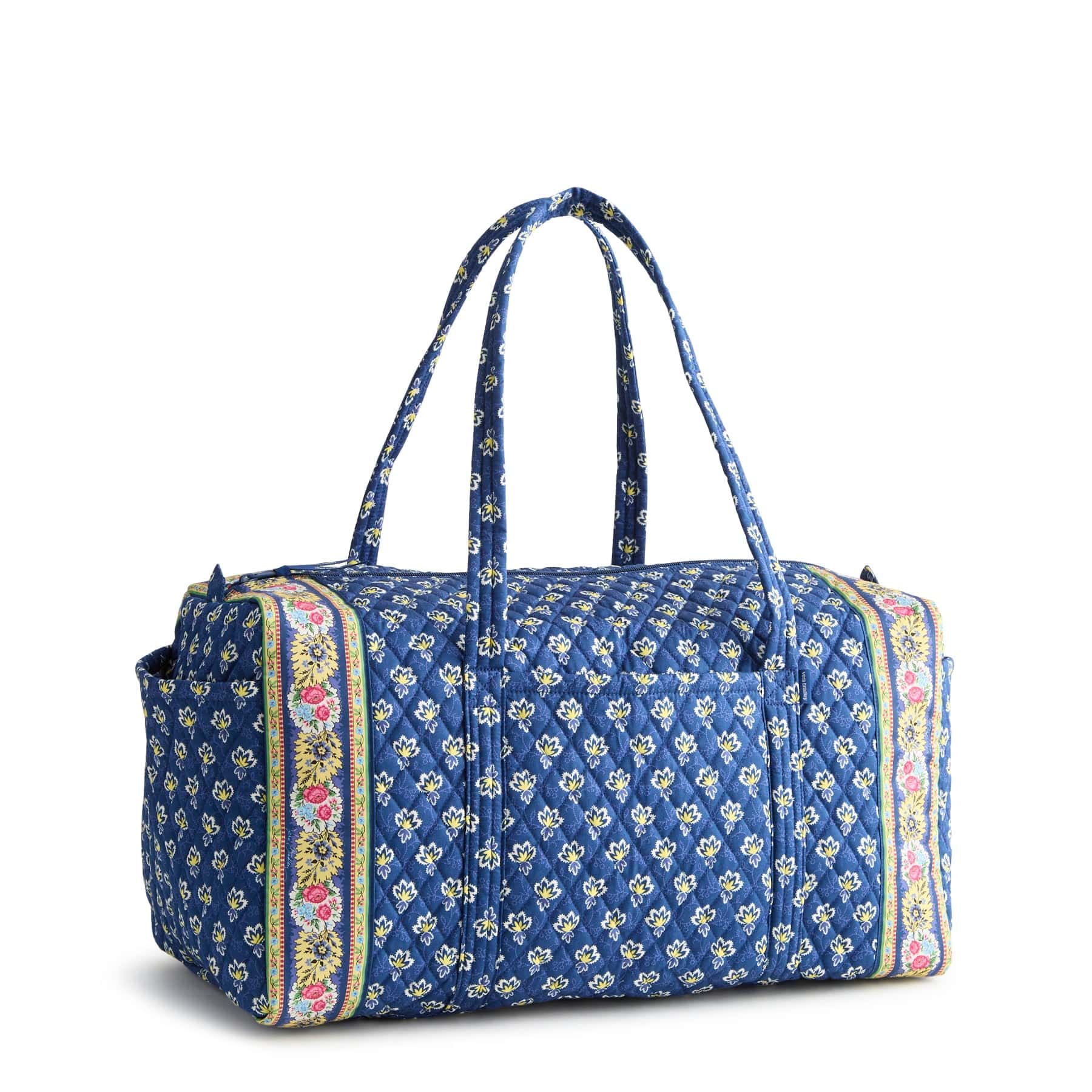 large blue quilted cotton duffel bag with yellow and pink floral pattern
