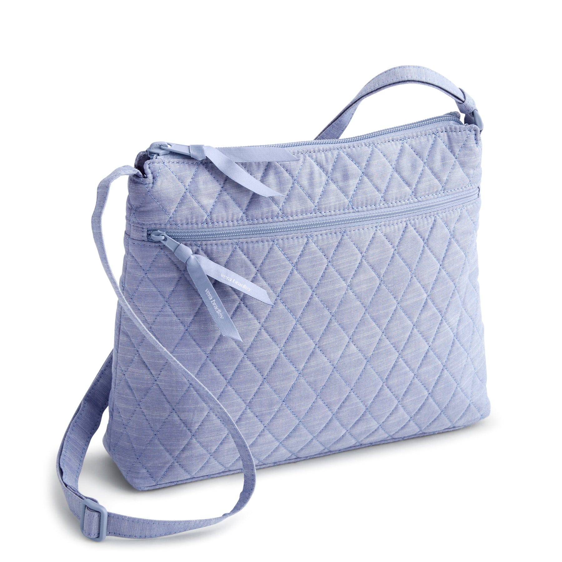 light blue chambray quilted cotton crossbody bag with two zip closures and adjustable strap