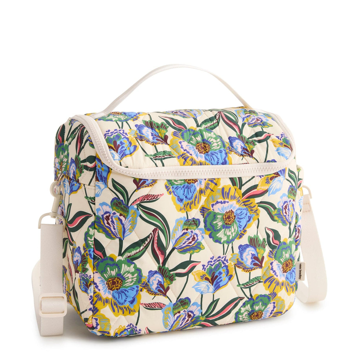 cream-colored quilted lunch bag with handle and crossbody strap in blue green and yellow floral pattern